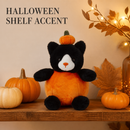 Halloween pumpkin cat plush displayed as a seasonal shelf accent