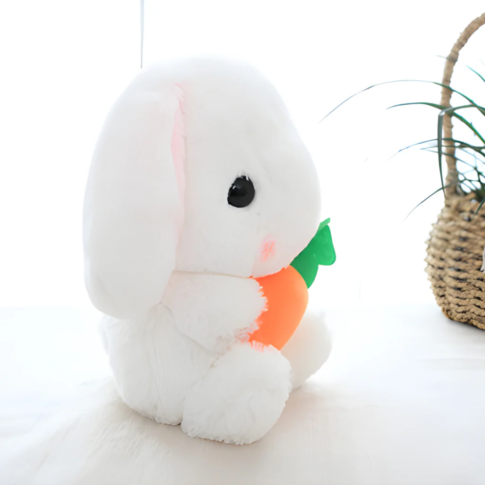 Sitting Right Side Easter Rabbit Holding Carrot, Featuring Soft Fur and a Cute Expression by Plushland.






