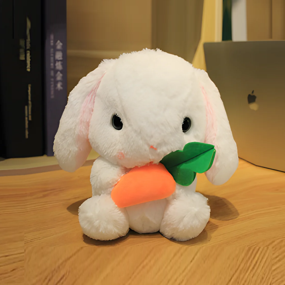 Sitting Table Easter Rabbit Holding Carrot, Featuring Soft Fur and a Cute Expression by Plushland.






