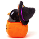 Side view of black crow plush with the orange pumpkin basket open