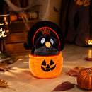 Black crow Halloween plush displayed with pumpkins and glowing lanterns
