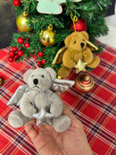 4" Xmas Angel Bear plush with golden wings, being held.