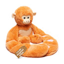 Weighted monkey stuffed animal hugger with white heart facing right 