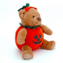 Side view of Halloween Bear Stuffed Animal wearing a pumpkin costume