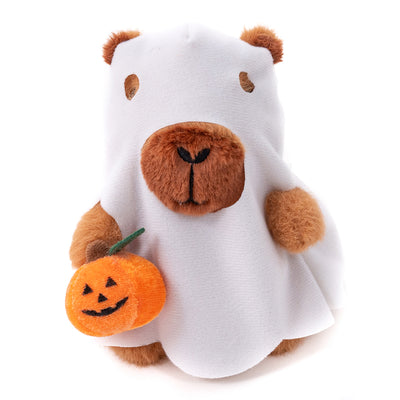 Halloween Capybara Plush in a ghost outfit holding a pumpkin treat bag in a front-facing pose