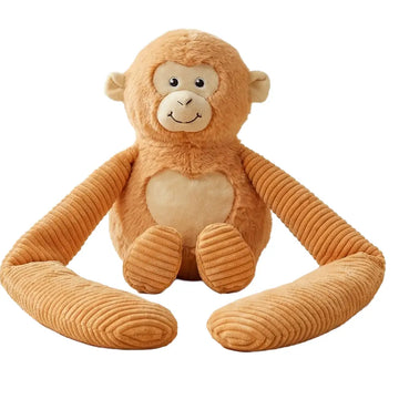 Weighted small monkey hugger toy sitting upright facing front on a white background