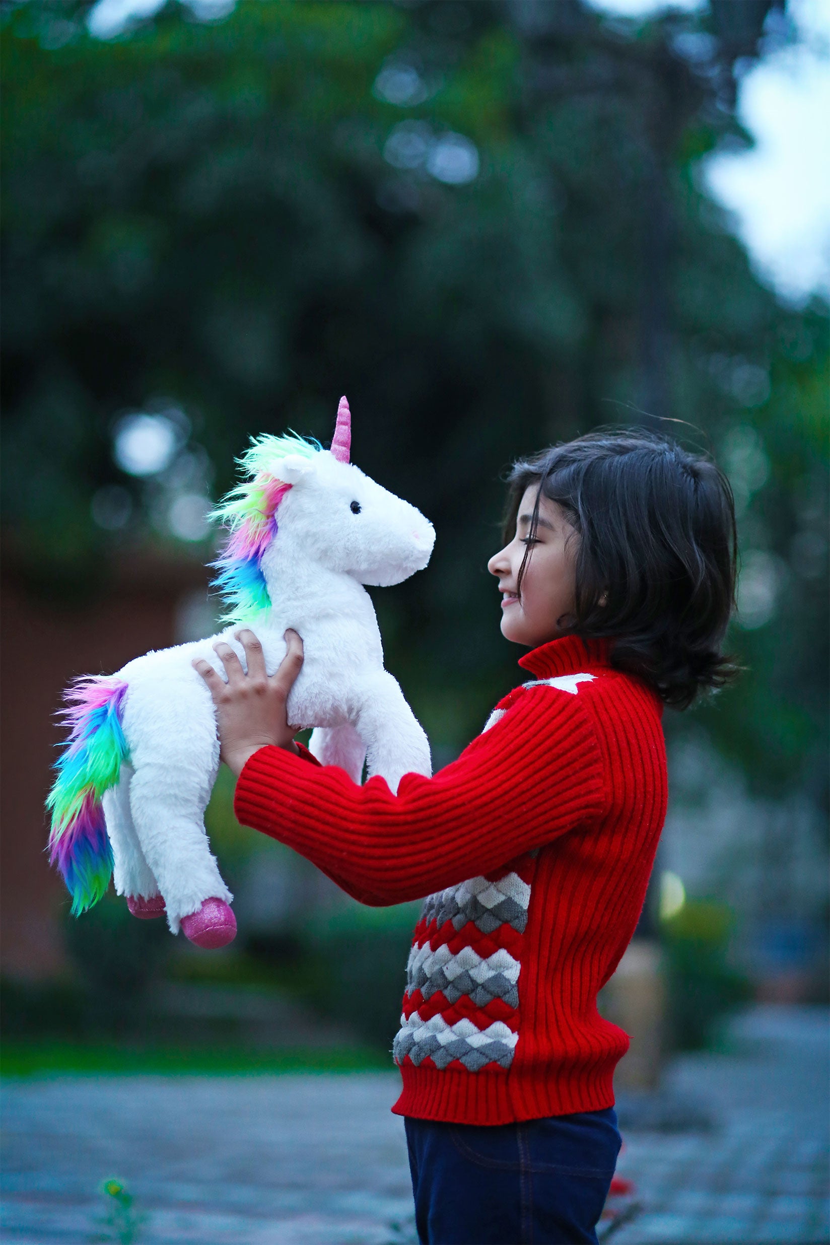 Crystal Unicorn Featuring Sparkling Details and a Magical Design, Held in a Child's Hands by Plushland.