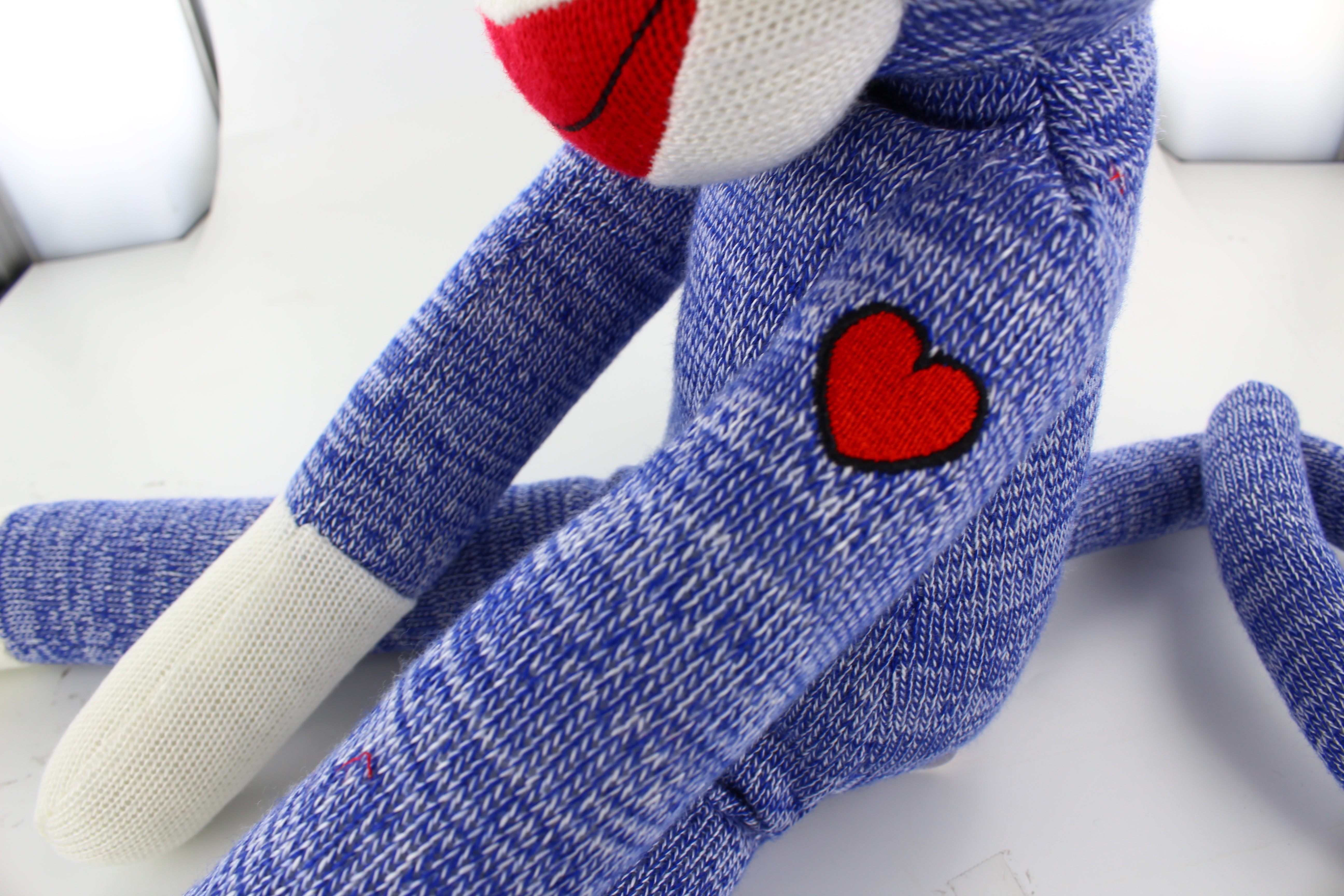 20-inch blue Color of Love Sockiez Side Look with left hand heart embroidery Sitting, soft plush toy by Plushland